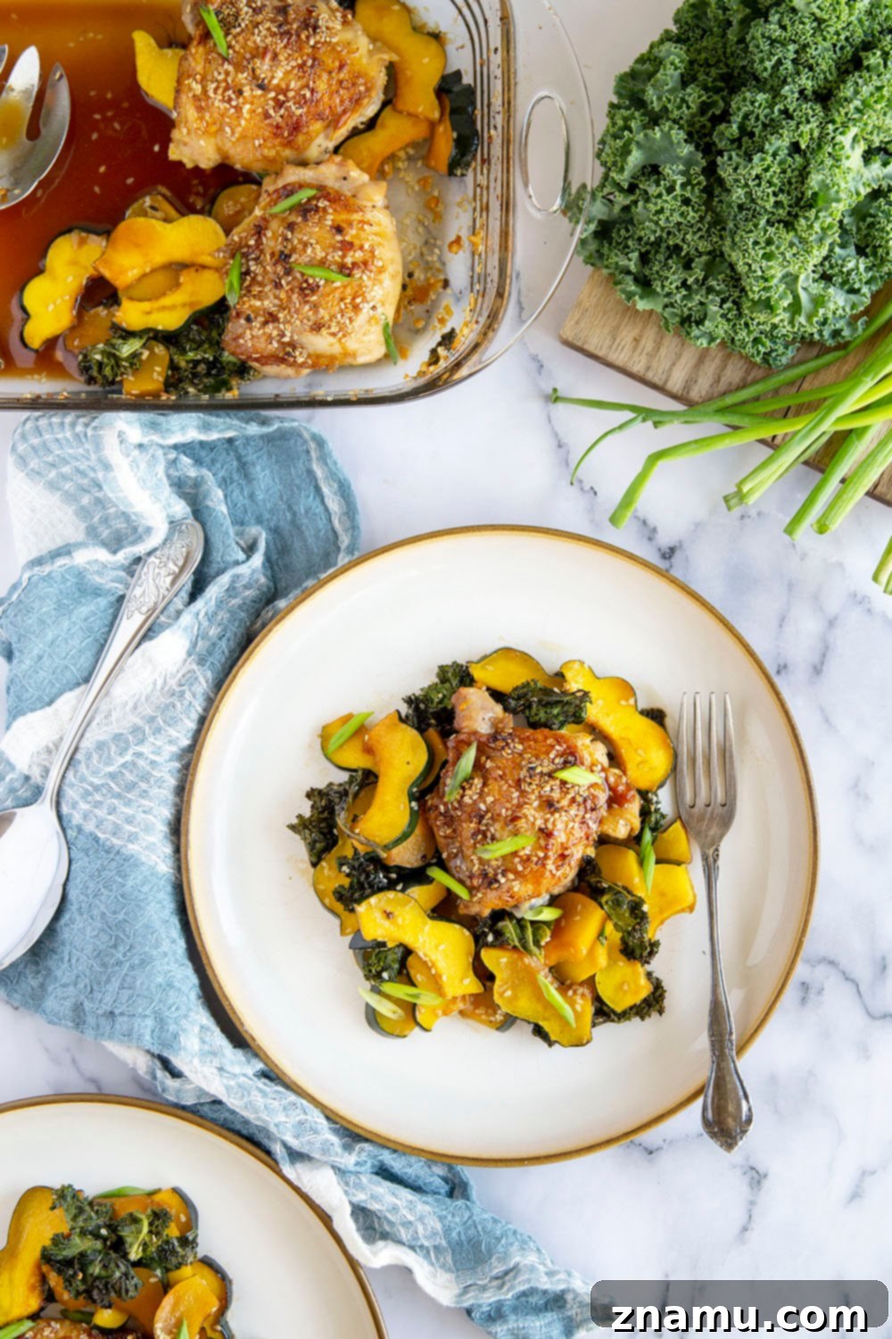 Honey Sesame Glazed Chicken Thighs with Roasted Acorn Squash and Sautéed Kale 6 Honey sesame chicken thighs are roasted with tender acorn squash and kale in a flavorful honey sesame sauce for an easy dinner made in less than an hour!