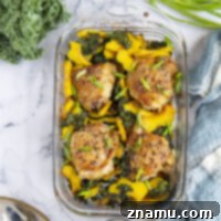 Honey sesame chicken thighs are roasted with tender acorn squash and kale in a flavorful honey sesame sauce for an easy dinner made in less than an hour!