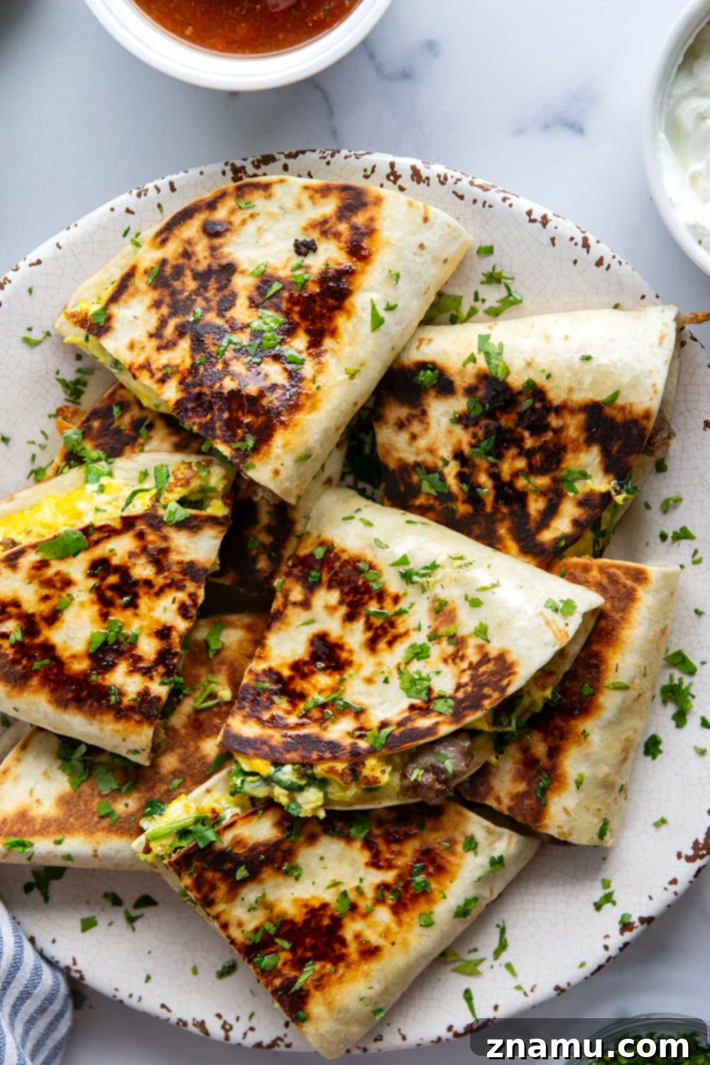 Wholesome Breakfast Quesadillas 6 A stack of perfectly golden-brown breakfast quesadilla wedges, showcasing their crispy exterior and ready to be served, a testament to a satisfying and healthy breakfast.