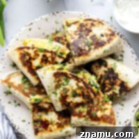 Wholesome Breakfast Quesadillas 8 Crispy on the outside and stuffed with fluffy eggs, sausage, and spinach inside, these healthy breakfast quesadillas are packed with protein and the best way to start the day!