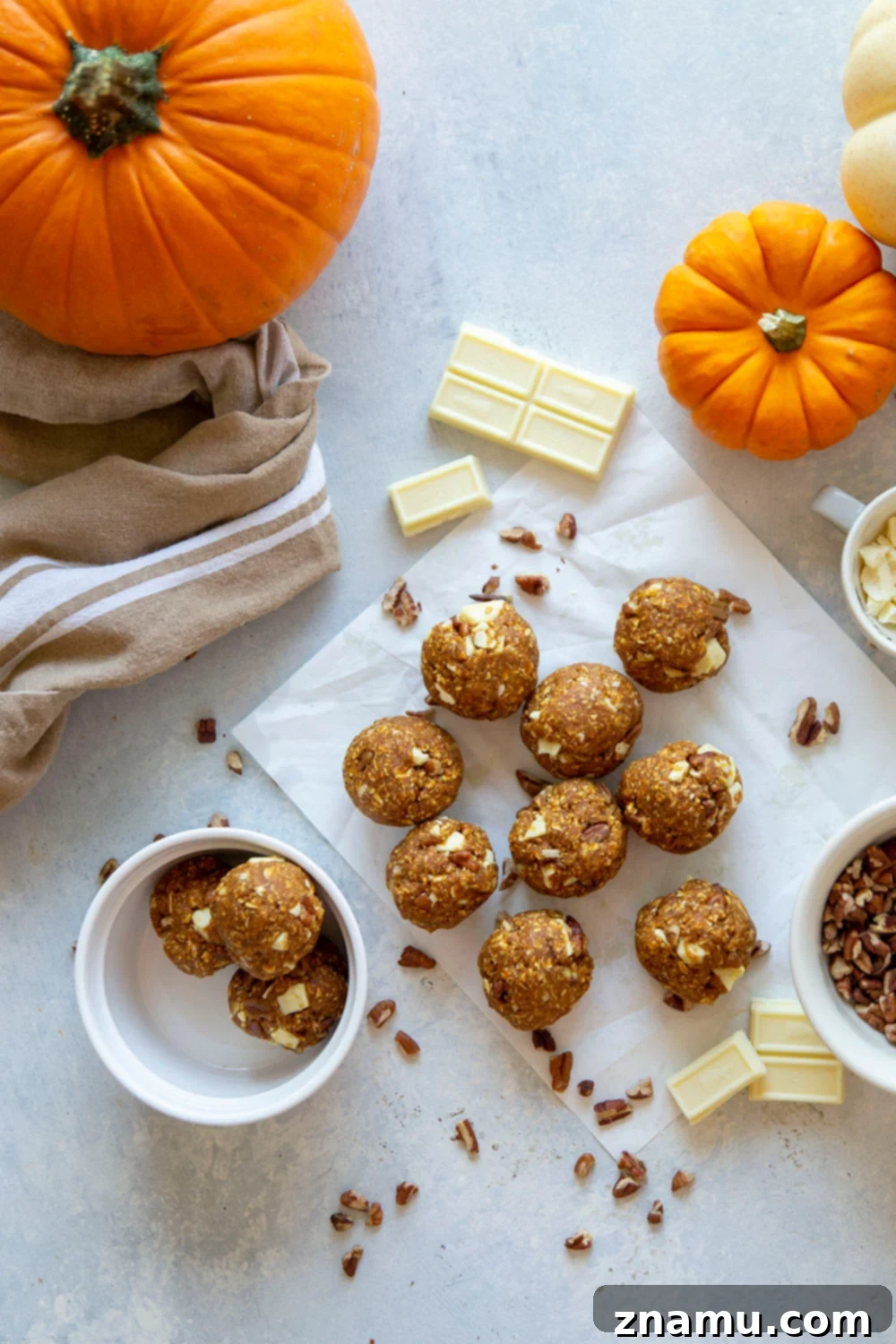 Pumpkin Spice Energy Gems 3 Close-up of a stack of pumpkin energy bites with chocolate chips.