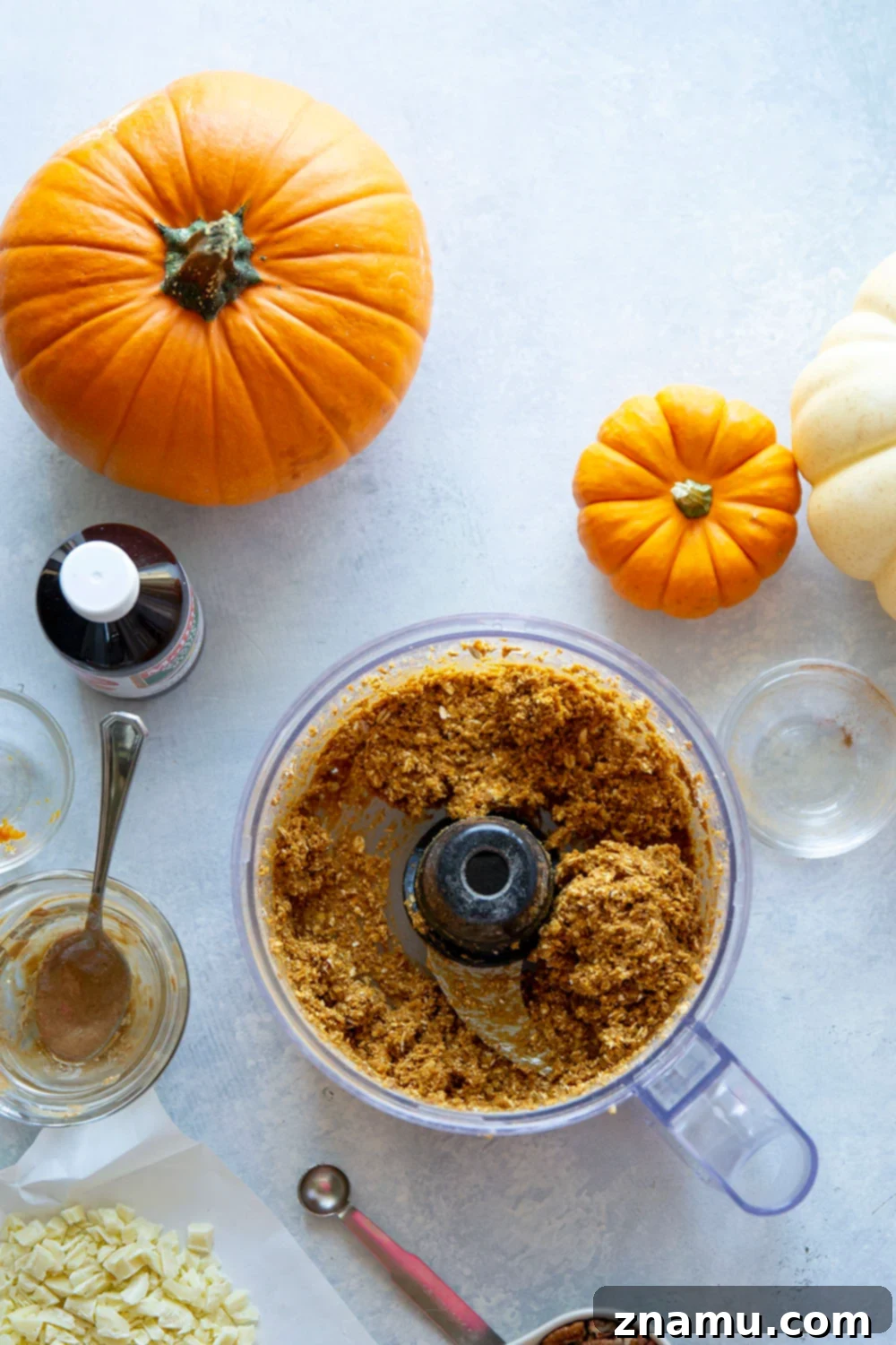 Pumpkin Spice Energy Gems 4 A bowl filled with freshly made no-bake pumpkin energy bites.