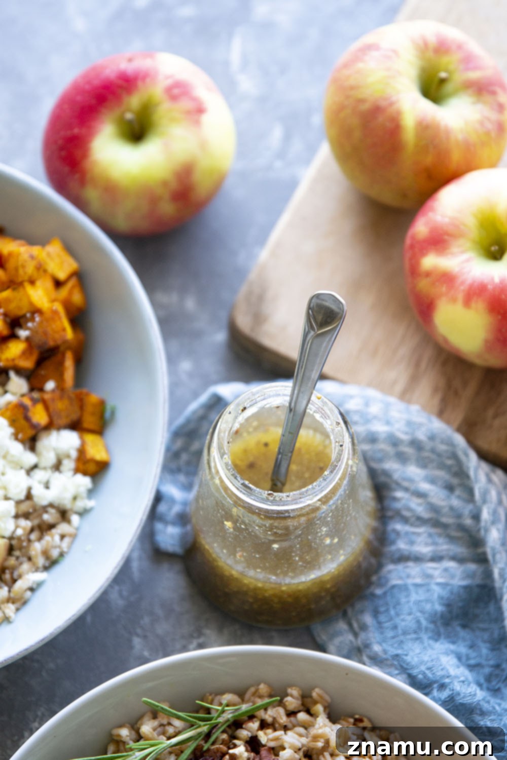Roasted Sweet Potato and Apple Harvest Grain Bowls 5 Ingredients for Harvest Grain Bowls laid out, including grains, sweet potatoes, and apples