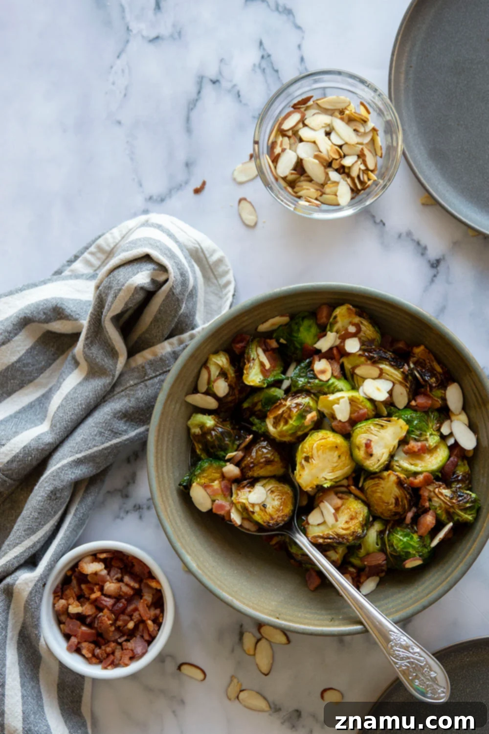 Blistered Air Fryer Brussels Sprouts with Hot Honey Butter 5 Air fryer basket filled with seasoned Brussels sprouts, demonstrating proper spacing for even cooking.