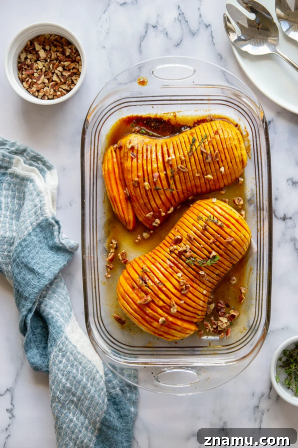 Maple Brown Butter Hasselback Butternut Bliss 2 Hasselback butternut squash is roasted with a sweet maple browned butter sauce and the perfect impressive side dish to put on your holiday table!