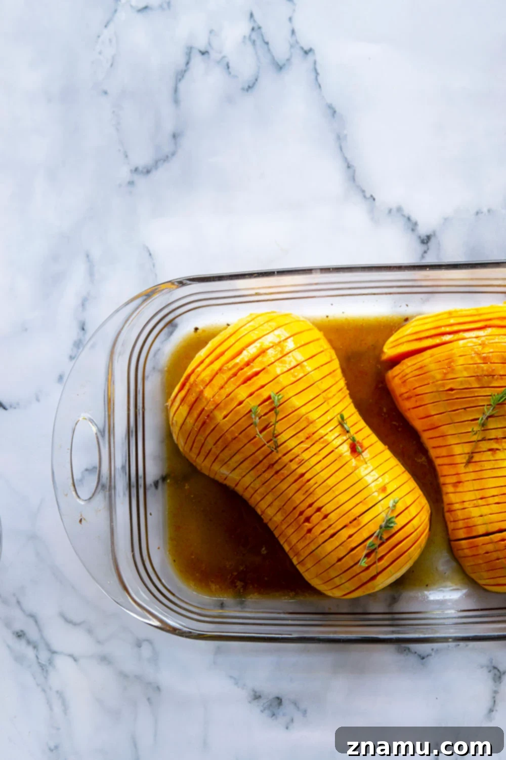 Maple Brown Butter Hasselback Butternut Bliss 3 Hasselback butternut squash is roasted with a sweet maple browned butter sauce and the perfect impressive side dish to put on your holiday table!
