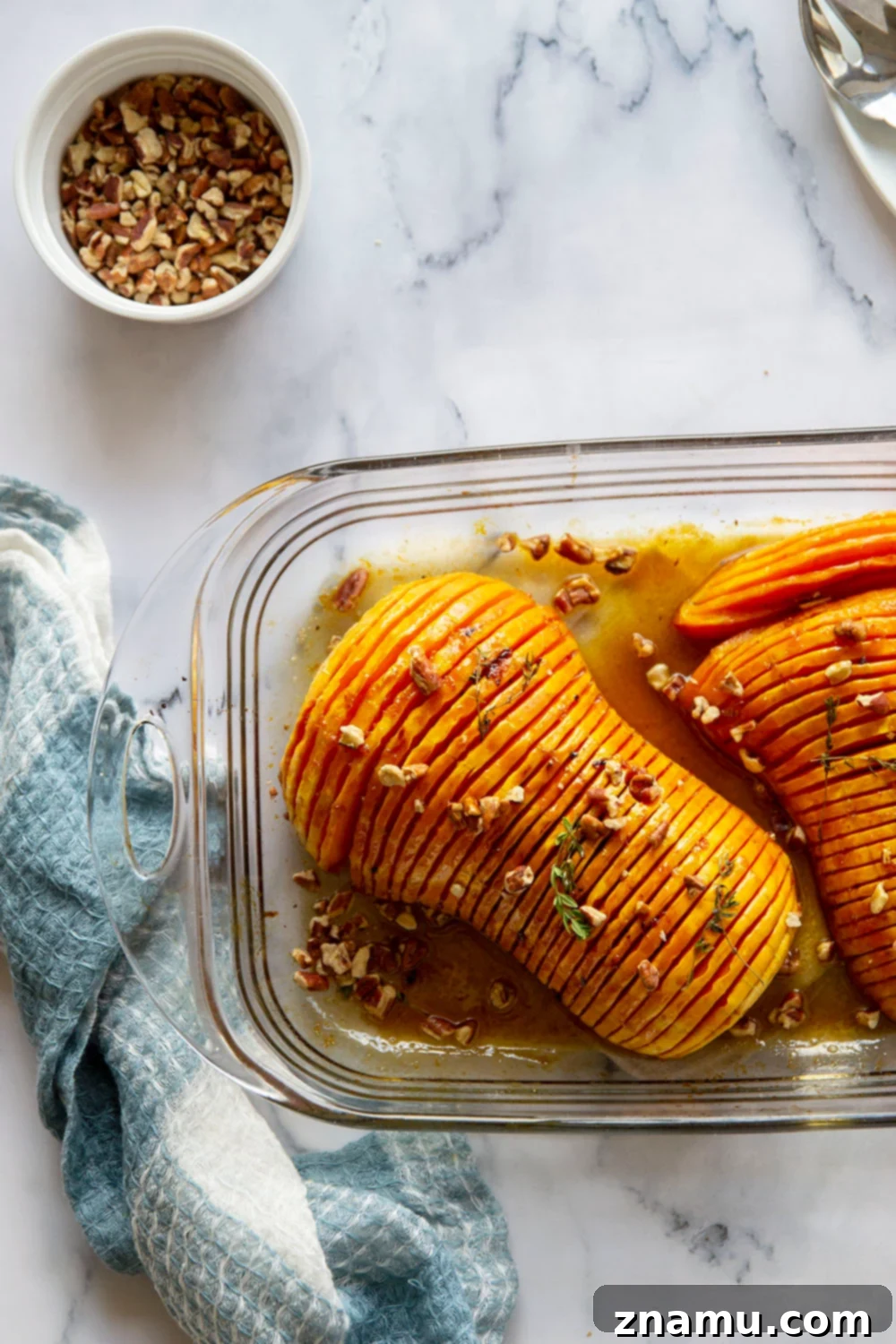 Maple Brown Butter Hasselback Butternut Bliss 4 Hasselback butternut squash is roasted with a sweet maple browned butter sauce and the perfect impressive side dish to put on your holiday table!
