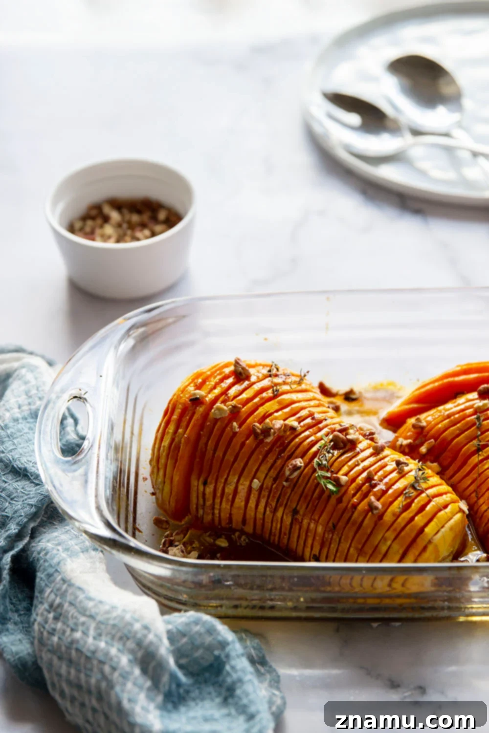 Maple Brown Butter Hasselback Butternut Bliss 5 Hasselback butternut squash is roasted with a sweet maple browned butter sauce and the perfect impressive side dish to put on your holiday table!