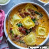 Instant Pot Tuscan Ravioli Soup finished dish in a bowl, garnished.