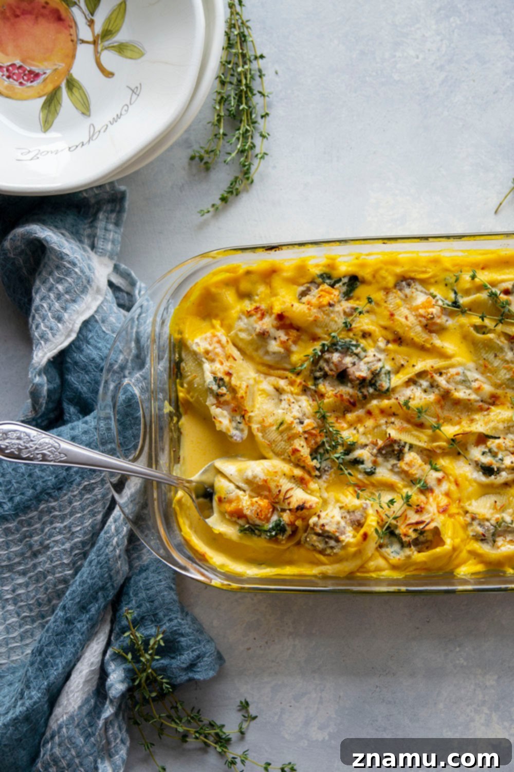 Golden Butternut Sausage Stuffed Shells 4 Creamy butternut squash alfredo sauce and flavorful sausage are featured in these luscious butternut squash stuffed shells. - easy to make ahead of time and perfect for any dinner occasion!