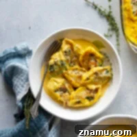 Golden Butternut Sausage Stuffed Shells 8 Creamy butternut squash alfredo sauce and flavorful sausage are featured in these luscious butternut squash stuffed shells. - easy to make ahead of time and perfect for any dinner occasion!