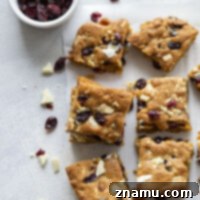 Blissful Cranberry White Chocolate Blondies 8 White chocolate cranberry blondies feature a soft, chewy blondie base with plenty of gooey white chocolate and soft dried cranberries in every bite!