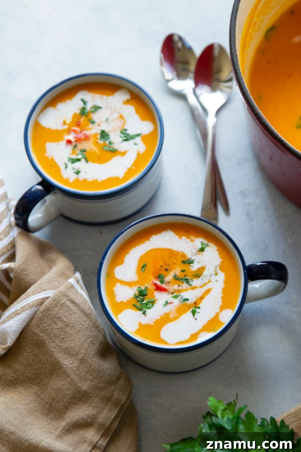 Sweet & Smoky Butternut Squash Soup with Coconut 5 Chopped butternut squash, carrots, and onions ready for soup preparation.