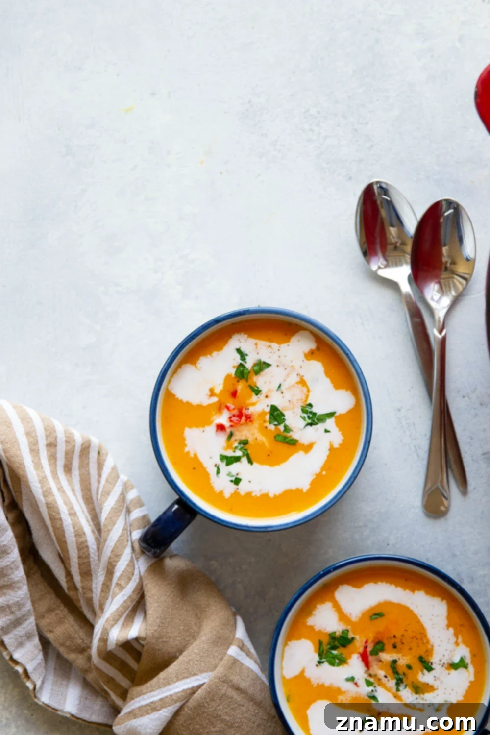Sweet & Smoky Butternut Squash Soup with Coconut 6 A close-up of the rich, creamy texture of the butternut squash soup in a bowl.