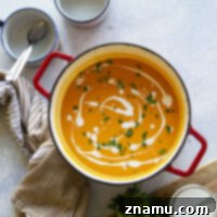 Silky butternut squash and flavorful roasted red peppers are an incredibly combo in this creamy coconut milk butternut squash soup. - fast to throw together and vegan-friendly!