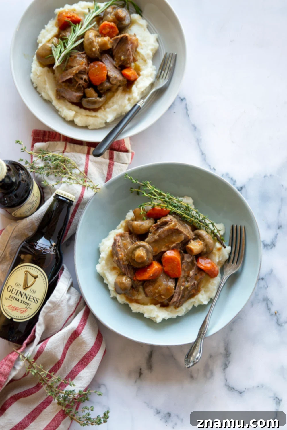 Guinness Braised Beef with Brown Butter Whipped Potatoes 2 Rich Guinness pot roast with fall-apart tender beef and vegetables, served over browned butter mashed potatoes in a Dutch oven.