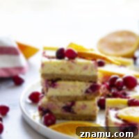 Zesty Orange Cranberry Cheesecake Bars 8 Swirled with a tangy cranberry sauce and loaded with tons of orange flavor, these orange cranberry cheesecake bars are easy to make and a standout on any holiday table!