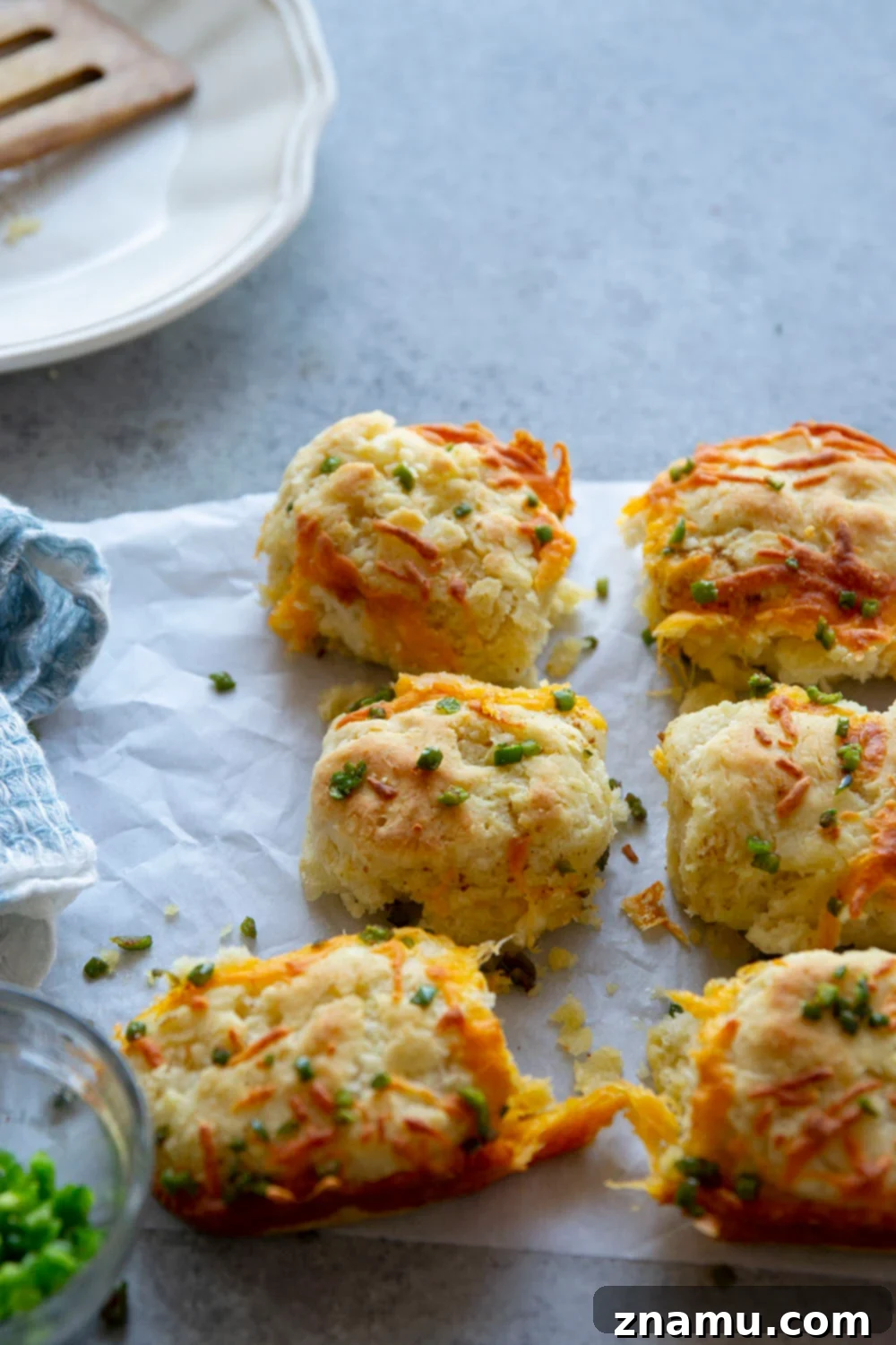 Fluffy Jalapeño Cheddar Pull-Apart Biscuits 3 Close-up of golden pull apart jalapeno cheddar biscuits baked to perfection, showcasing flaky texture and cheesy interior.