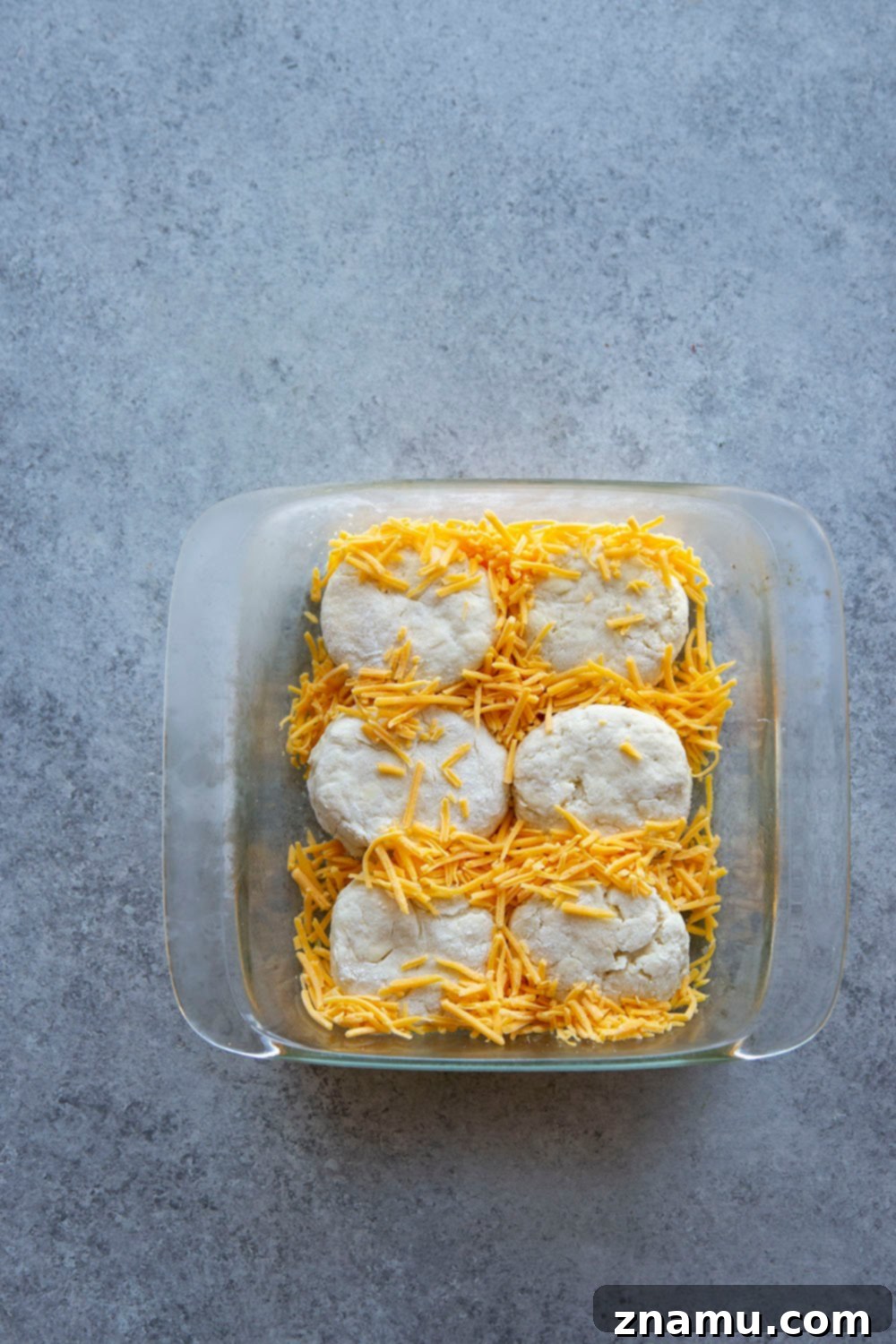 Fluffy Jalapeño Cheddar Pull-Apart Biscuits 4 Variety of ingredients laid out for making pull apart jalapeno cheddar biscuits, including flour, butter, cheese, and jalapeno.