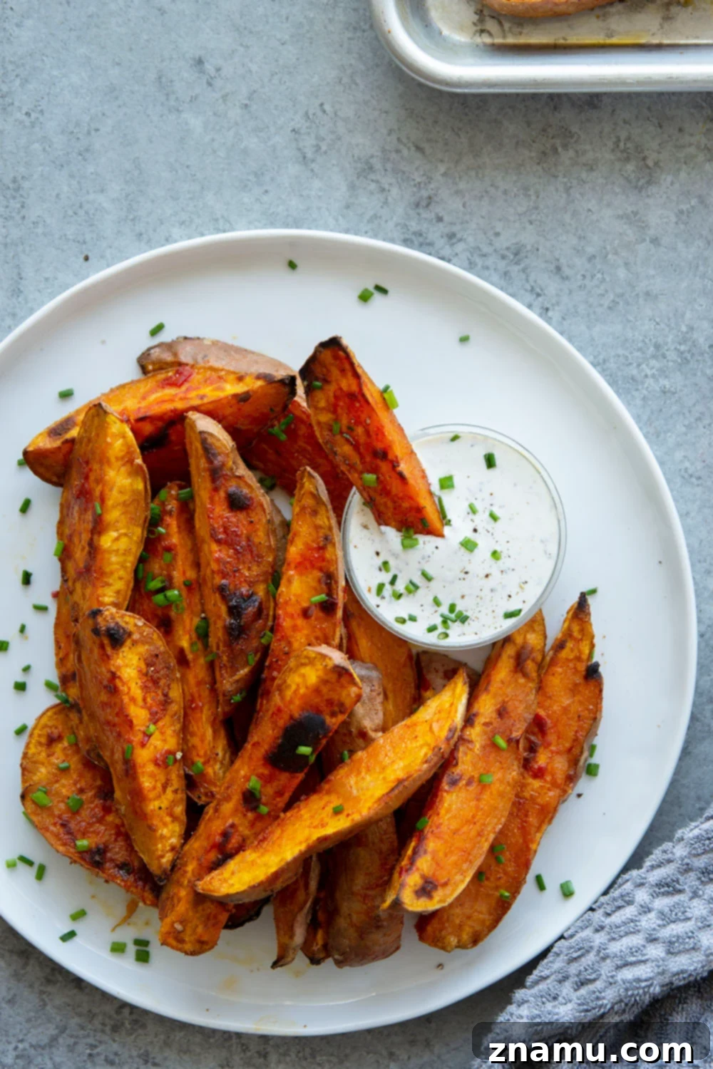 Fiery Harissa Sweet Potato Wedges with Cool Garlic Herb Aioli 4 Harissa roast sweet potato wedges pack a flavorful punch of heat and are perfectly crispy on the outside and fluffy on the inside.-- serve with a garlic herb aioli for dipping!