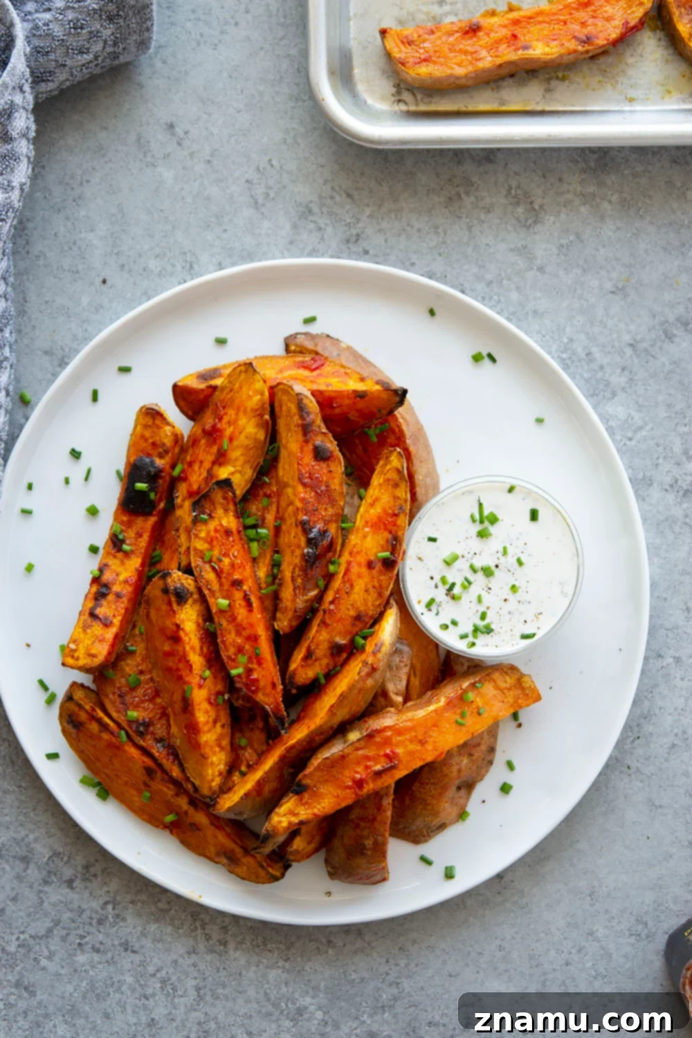 Fiery Harissa Sweet Potato Wedges with Cool Garlic Herb Aioli 6 Harissa roast sweet potato wedges pack a flavorful punch of heat and are perfectly crispy on the outside and fluffy on the inside.-- serve with a garlic herb aioli for dipping!