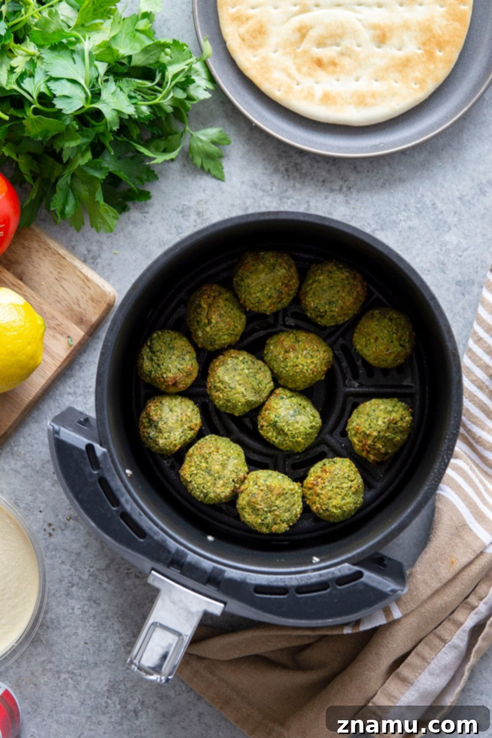 Crispy Air Fryer Falafel 4 A close-up shot of crispy air-fried falafel, showcasing its golden-brown exterior and enticing texture.