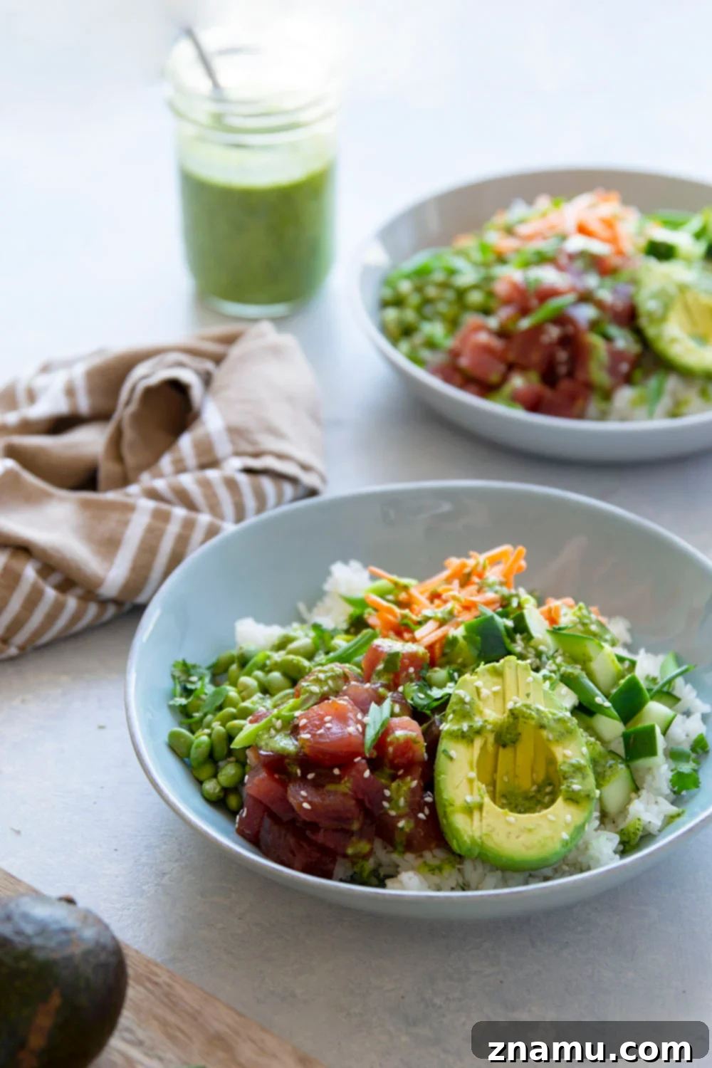 Spicy Green Curry Tuna Poke Bowls 5 A bowl of marinated sushi-grade ahi tuna cubes ready for a spicy poke bowl.