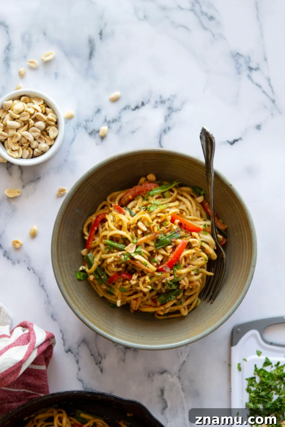 One-Pan Fiery Peanut Noodles 2 Spicy peanut noodles are made in minutes in a skillet and packed with tender vegetables and noodles in a perfectly creamy, spicy peanut sauce.