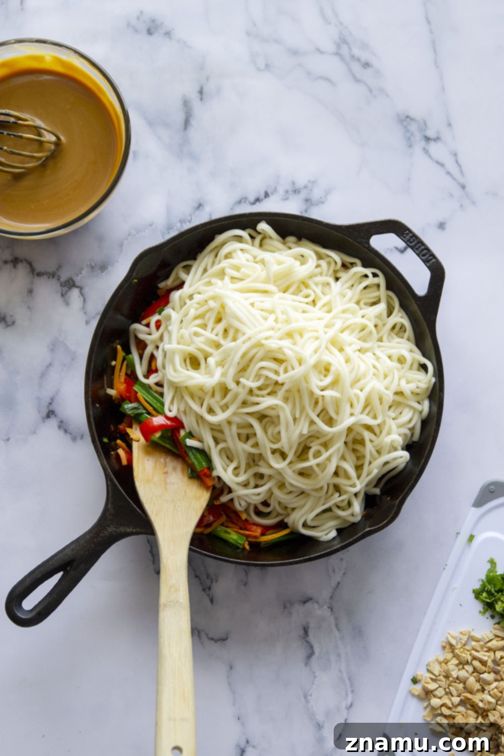 One-Pan Fiery Peanut Noodles 3 Spicy peanut noodles are made in minutes in a skillet and packed with tender vegetables and noodles in a perfectly creamy, spicy peanut sauce.