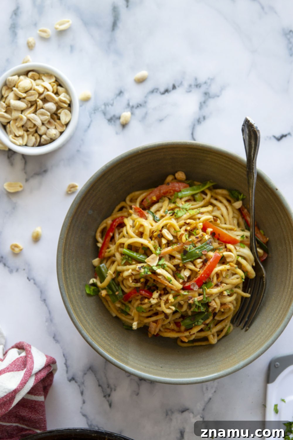 One-Pan Fiery Peanut Noodles 5 Spicy peanut noodles are made in minutes in a skillet and packed with tender vegetables and noodles in a perfectly creamy, spicy peanut sauce.