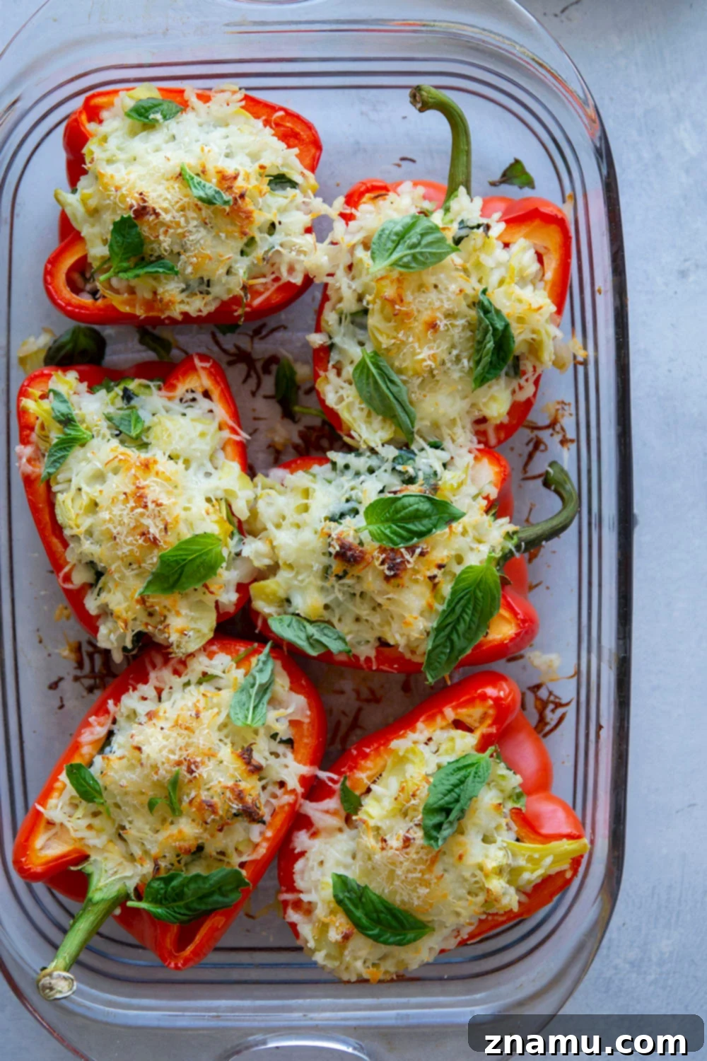 Creamy Spinach Artichoke Risotto Stuffed Bell Peppers 2 Risotto stuffed peppers feature a creamy spinach artichoke risotto stuffed into big sweet peppers and covered in melty mozzarella and fresh herbs.