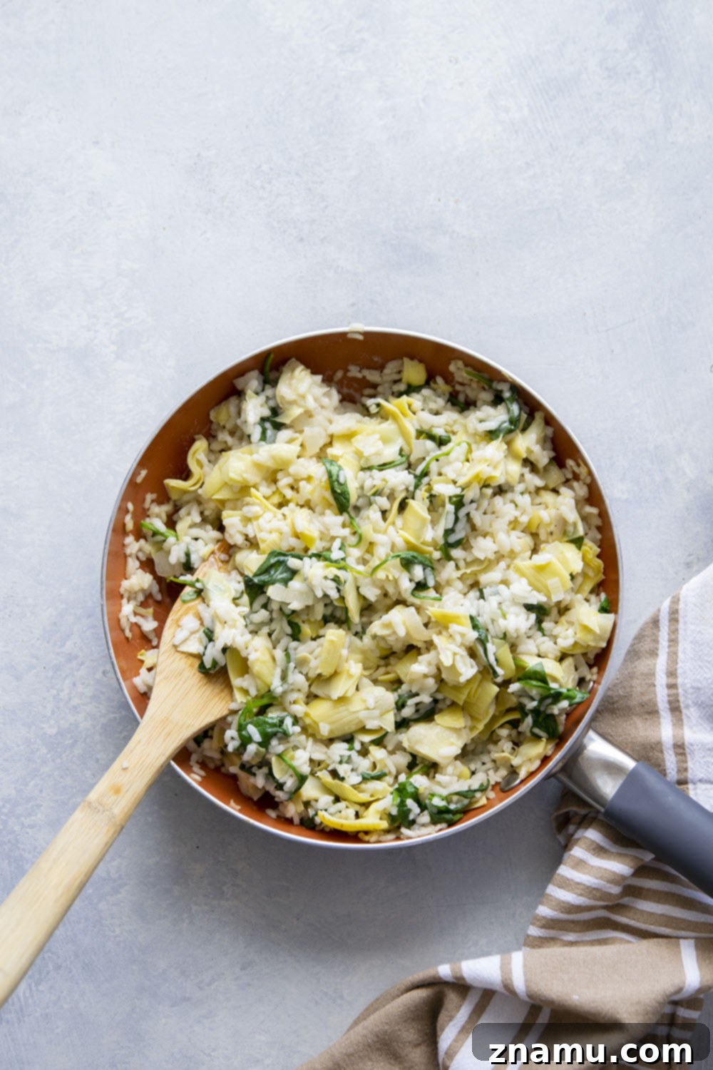 Creamy Spinach Artichoke Risotto Stuffed Bell Peppers 4 Risotto stuffed peppers feature a creamy spinach artichoke risotto stuffed into big sweet peppers and covered in melty mozzarella and fresh herbs.