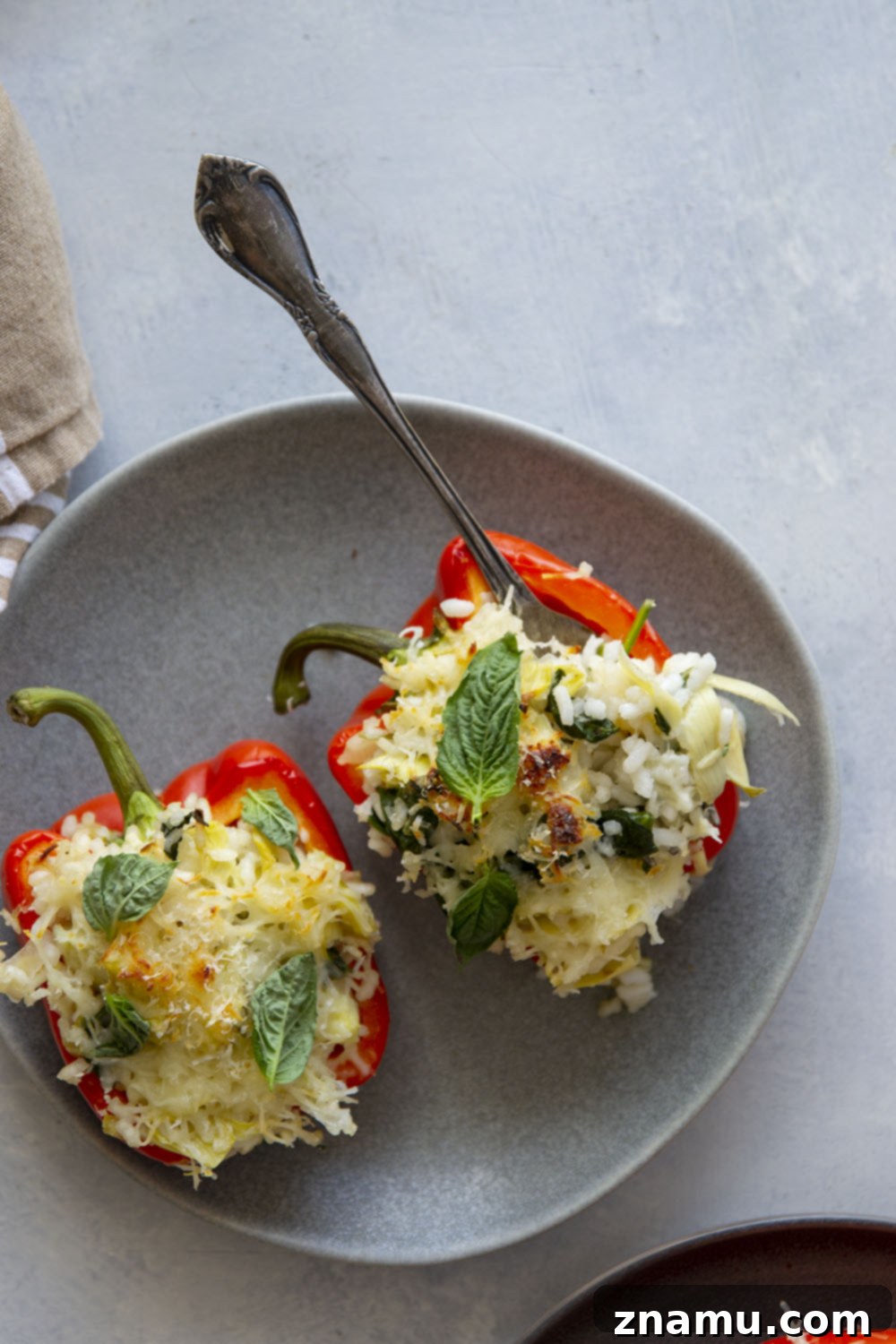 Creamy Spinach Artichoke Risotto Stuffed Bell Peppers 6 Risotto stuffed peppers feature a creamy spinach artichoke risotto stuffed into big sweet peppers and covered in melty mozzarella and fresh herbs.
