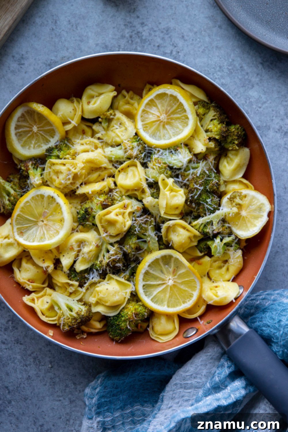 Zesty Roasted Broccoli Tortellini 5 A bowl of fresh, uncooked cheese tortellini, ready to be prepared for the Lemon Roasted Broccoli Tortellini recipe.