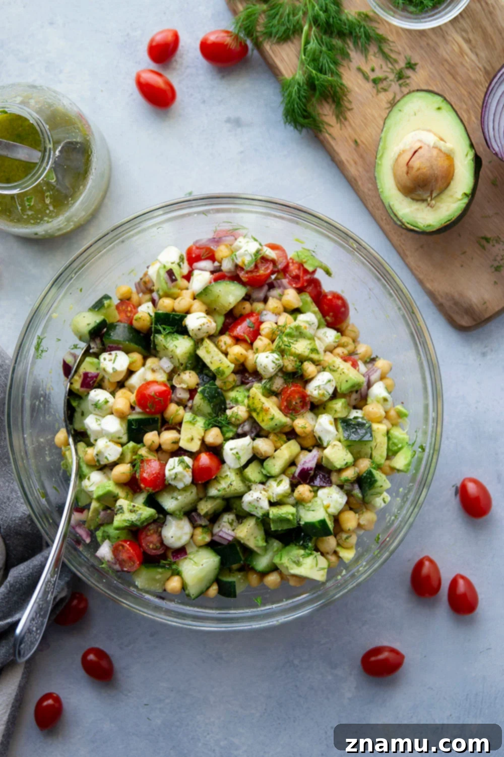 Creamy Italian Avocado Chickpea Salad 2 A vibrant Italian Avocado Chickpea Salad with creamy avocado, tender chickpeas, juicy tomatoes, crisp cucumber, and fresh mozzarella, all tossed in a zesty Italian dressing. Ideal for a healthy lunch or a delicious side dish.