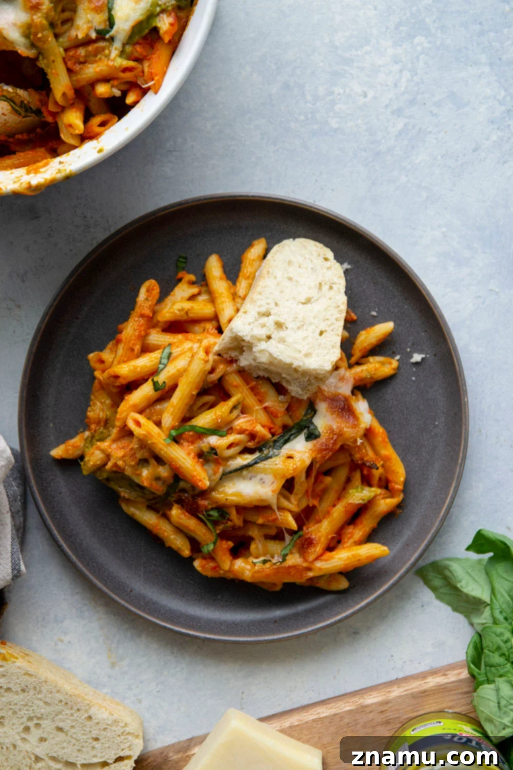 Penne Alla Vodka Pesto Bake 6 Baked penne alla vodka features a rich homemade tomato vodka sauce, swirls of flavorful pesto, and lots of gooey cheese baked on top.