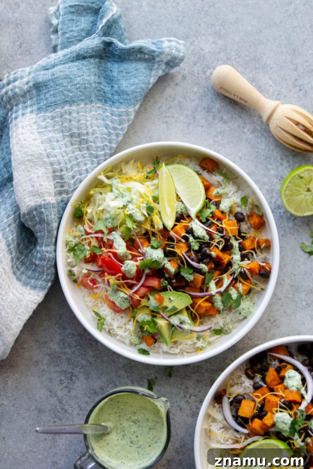 Vibrant Black Bean & Sweet Potato Burrito Bowls with Tangy Lime-Cilantro Drizzle 2 Black bean sweet potato burrito bowls are loaded with fluffy steamed rice, tender roasted sweet potatoes and black beans, a creamy cilantro lime sauce, and all your favorite burrito toppings!