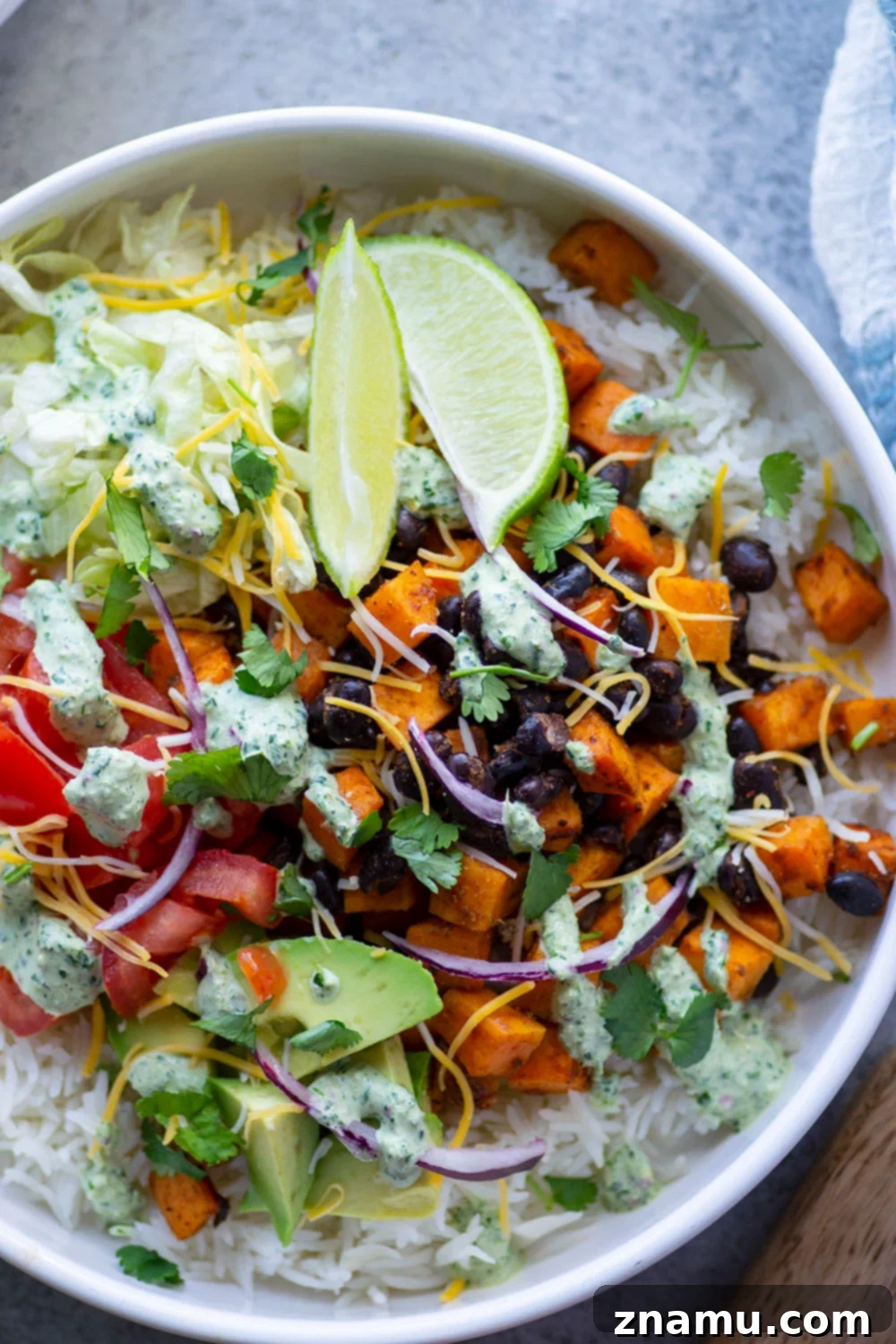 Vibrant Black Bean & Sweet Potato Burrito Bowls with Tangy Lime-Cilantro Drizzle 3 Black bean sweet potato burrito bowls are loaded with fluffy steamed rice, tender roasted sweet potatoes and black beans, a creamy cilantro lime sauce, and all your favorite burrito toppings!