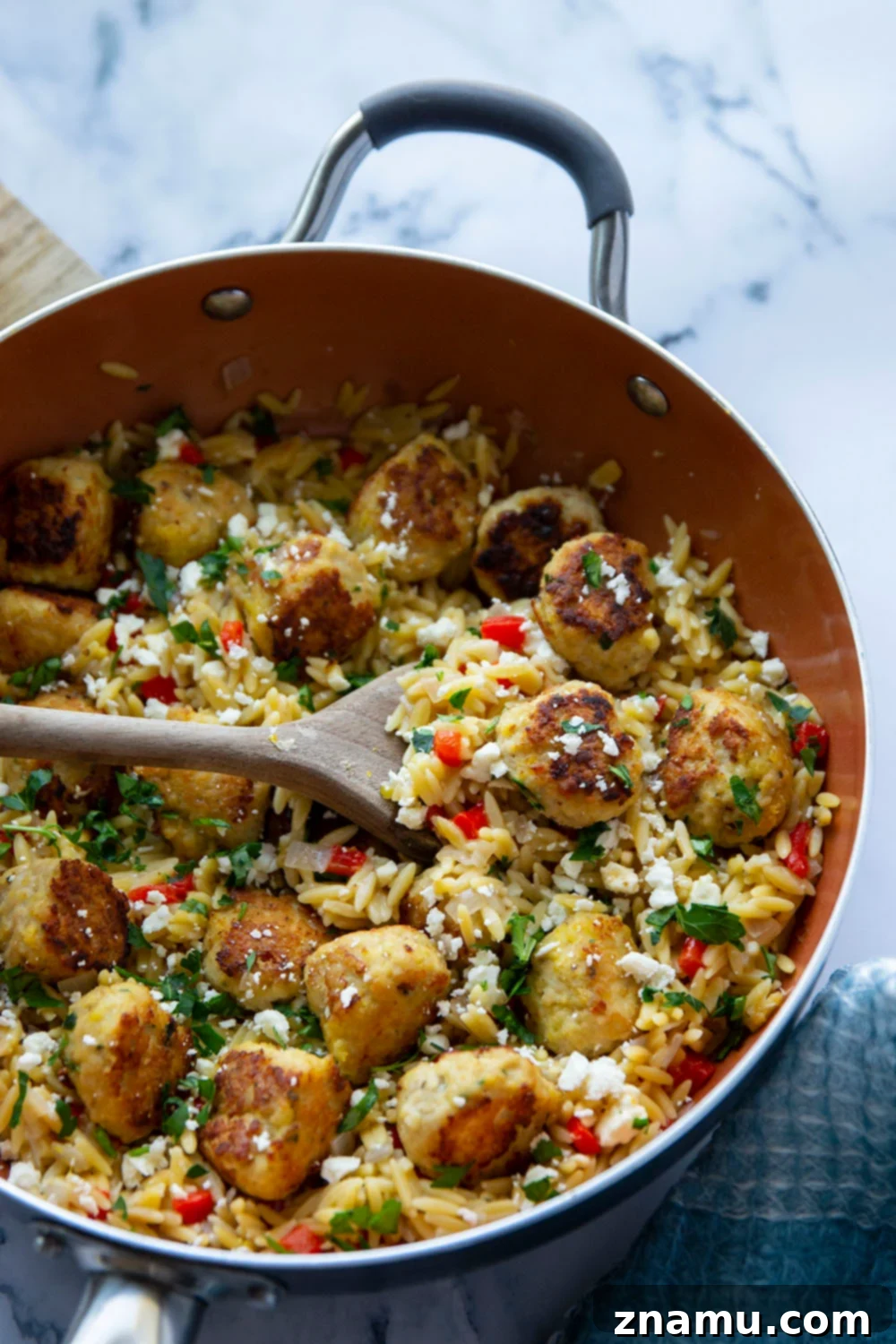 Easy Greek Meatball and Orzo Skillet 4 Close-up of Greek Meatballs and Orzo with Feta and Olives