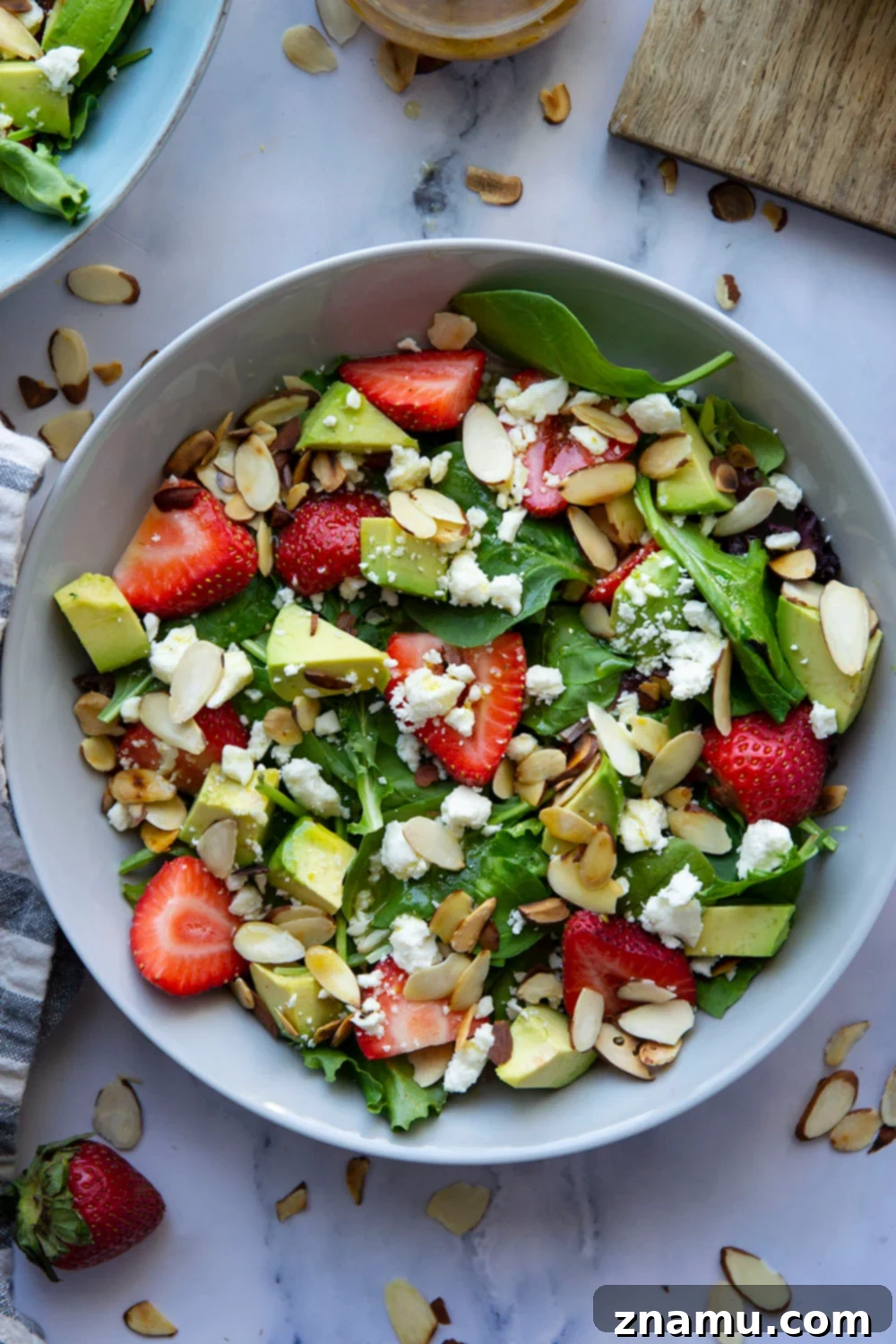 Vibrant Strawberry Avocado Salad with Tangy Maple Dijon 3 This strawberry avocado salad is loaded with juicy strawberries, silky avocado, and tossed in a sweet dijon maple dressing. - a quick and beautiful salad to throw together last minute!
