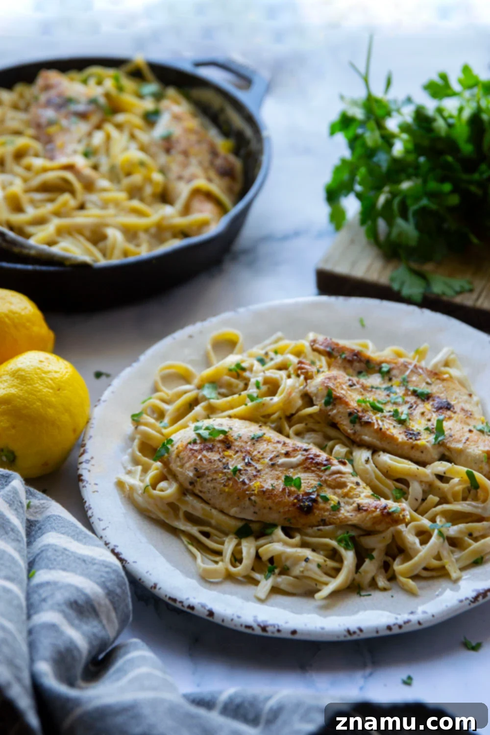 Creamy Lemon Pepper Chicken Alfredo Fettuccine 5 Sliced chicken breasts prepared for lemon pepper seasoning.