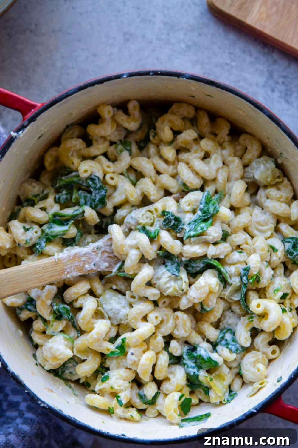 Effortless One-Pot Spinach Artichoke Pasta 6 Overhead shot of the entire pot of creamy One-Pot Spinach Artichoke Pasta.