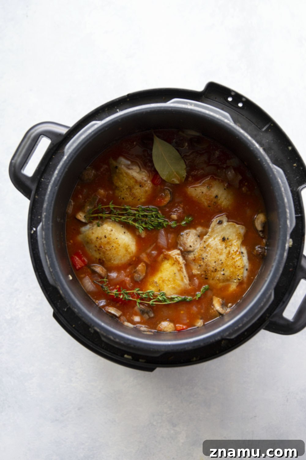 Effortless Instant Pot Chicken Cacciatore 3 Instant Pot Chicken Cacciatore served over pasta for a rustic Italian dinner