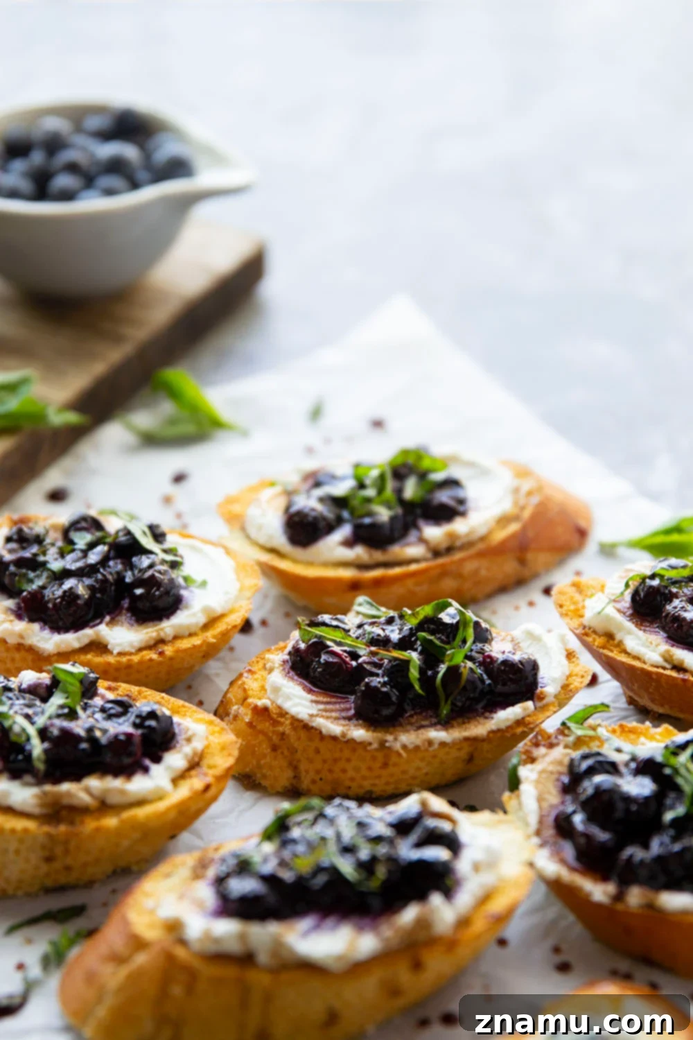 Blueberry Basil Ricotta Crostini 4 Slices of French bread toasted and layered with creamy ricotta cheese