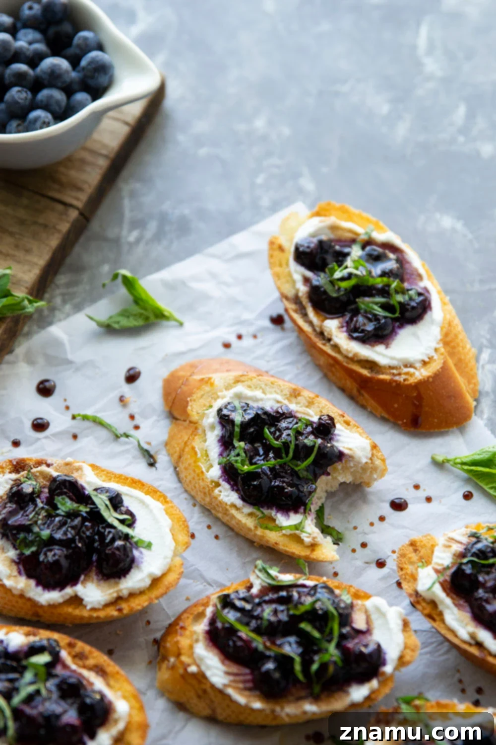 Blueberry Basil Ricotta Crostini 6 Serving platter of blueberry ricotta bruschetta with balsamic glaze