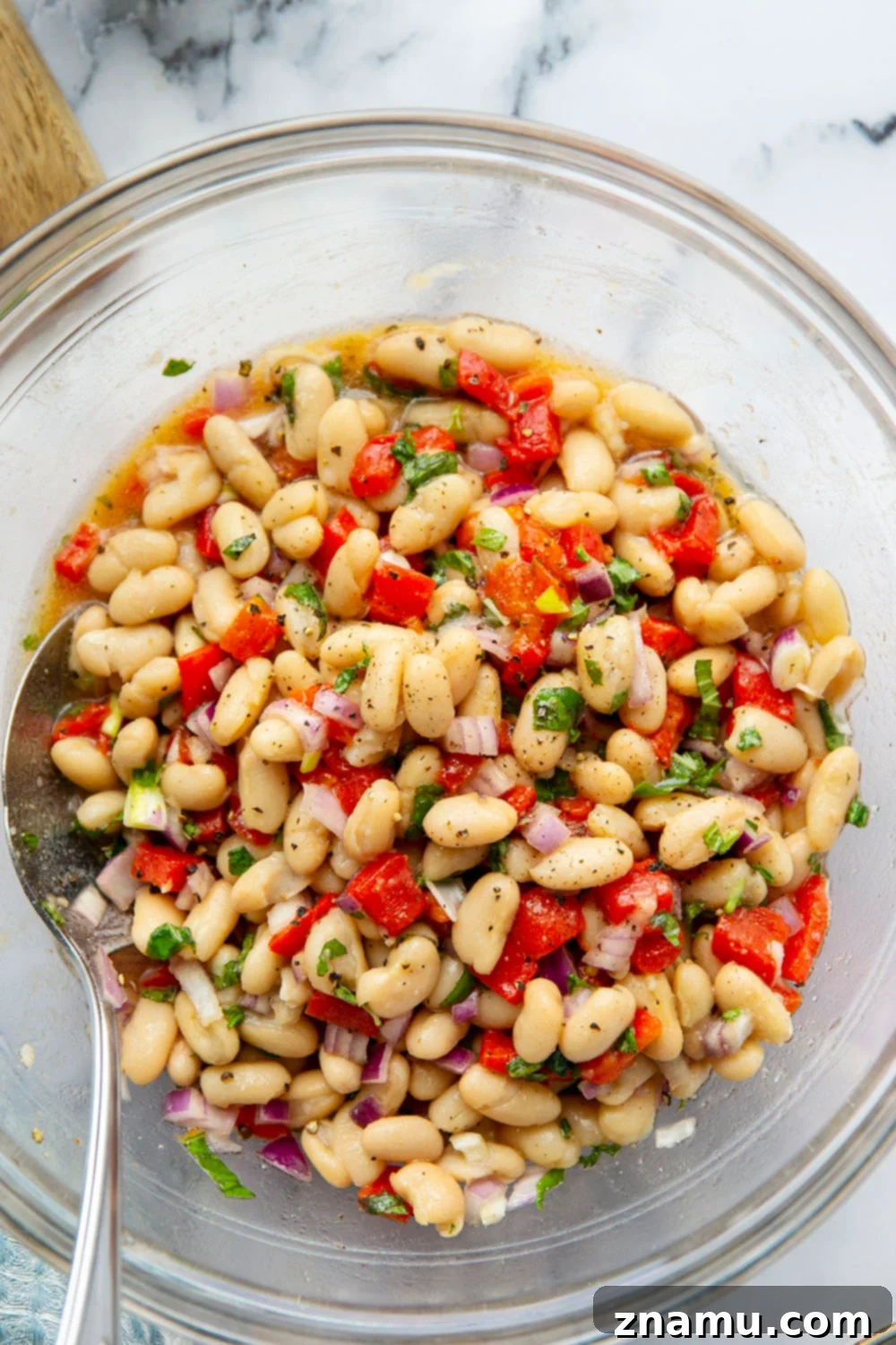 Miso Infused White Bean & Roasted Red Pepper Salad 2 Vibrant white bean salad with roasted red peppers, fresh basil, and mint in a miso dressing, ready to be served as a delicious side dish for summer cookouts.