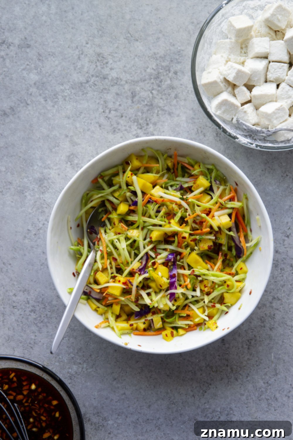 Smoky Korean BBQ Tofu Bowls with Spicy Mango Slaw 5 Korean BBQ tofu bowls feature perfectly crisp and saucy tofu piled over fluffy rice with a sweet and spicy mango slaw on top.