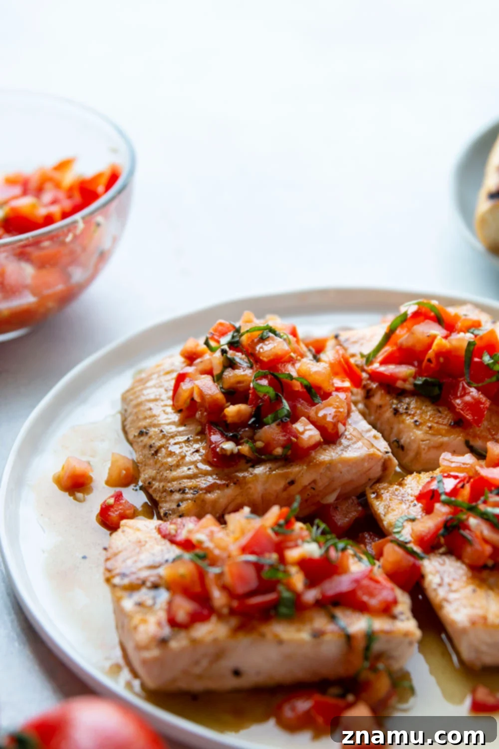 Fresh Tomato Bruschetta on Grilled Salmon This grilled bruschetta salmon features perfectly grilled salmon fillets with a flavorful tomato bruschetta topping piled over top and lots of crusty grilled bread on the side.