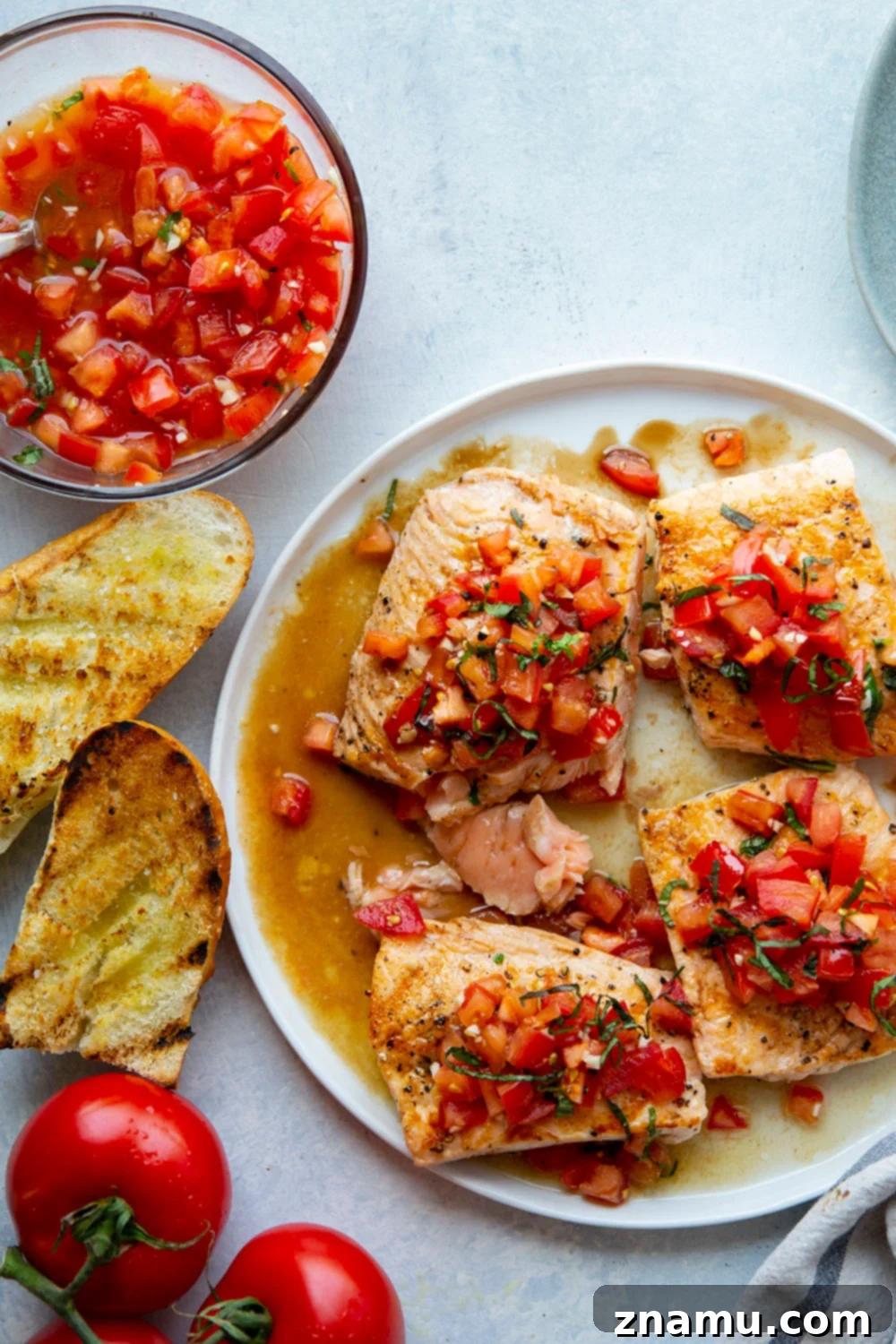 Perfectly Cooked Salmon Fillets This grilled bruschetta salmon features perfectly grilled salmon fillets with a flavorful tomato bruschetta topping piled over top and lots of crusty grilled bread on the side.