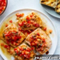 Zesty Bruschetta Salmon Fillets 2 This grilled bruschetta salmon features perfectly grilled salmon fillets with a flavorful tomato bruschetta topping piled over top and lots of crusty grilled bread on the side.